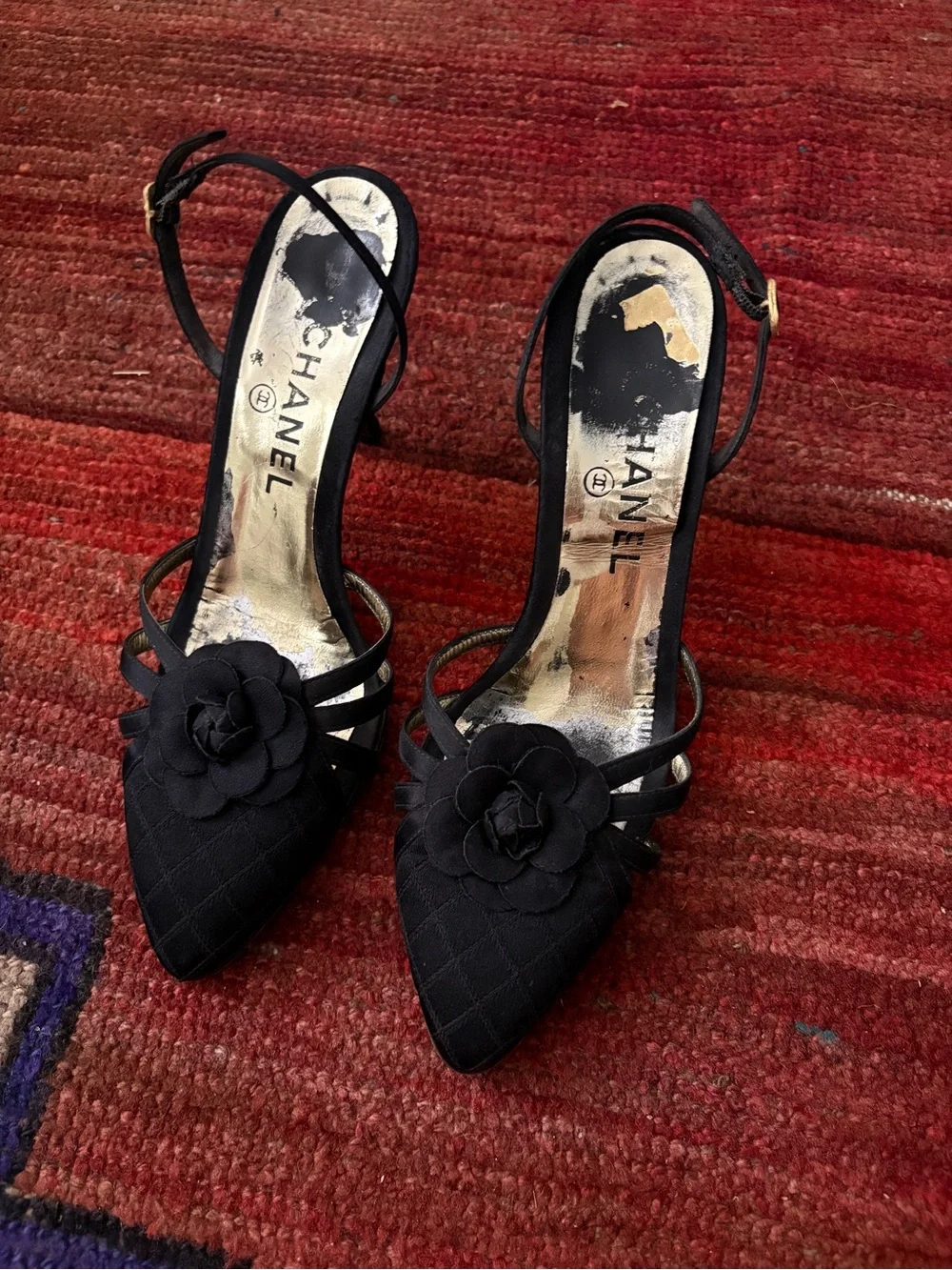 CHANEL Black Quilted Pointed-Toe Slingback Heels with Camellia Detail